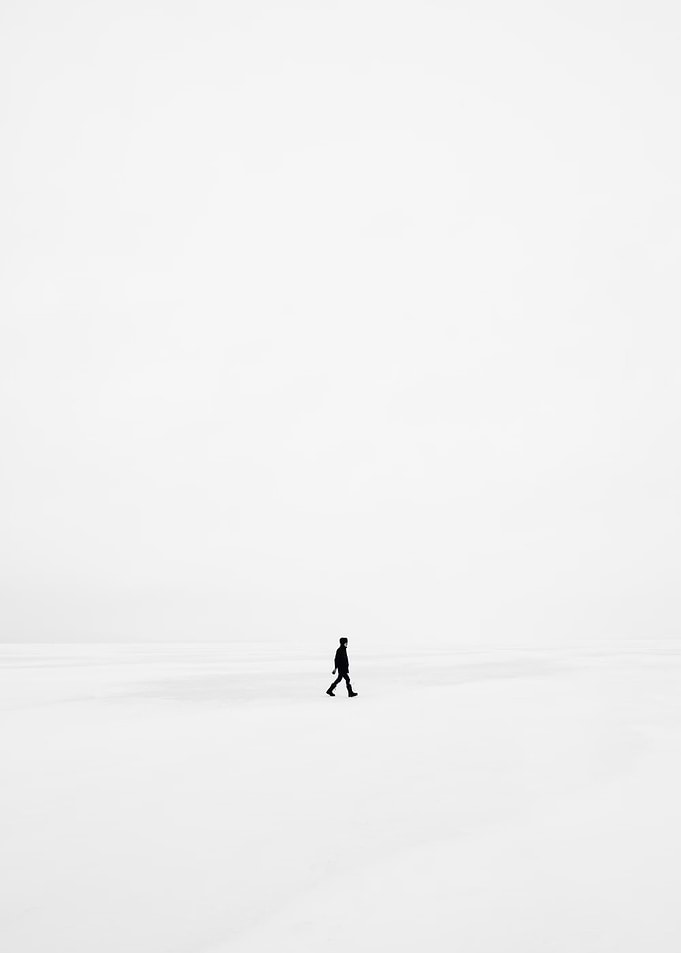 Solitary Figure in a White Landscape
