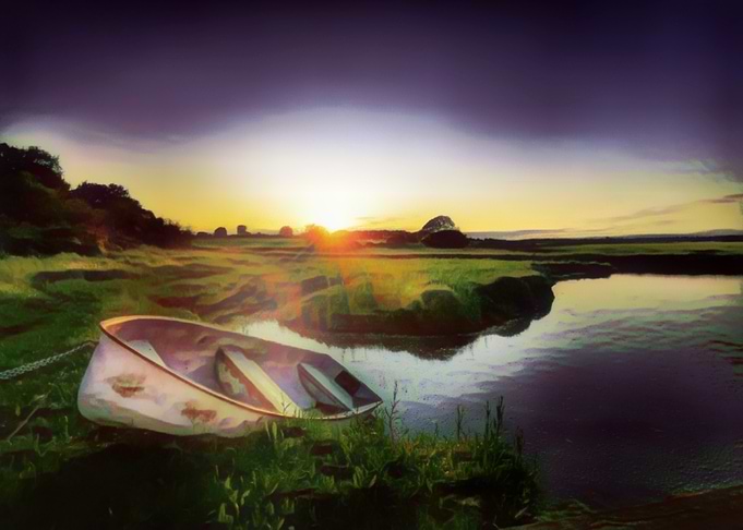 Rowing boat moored at sunset on the River Deben in Suffolk, UK