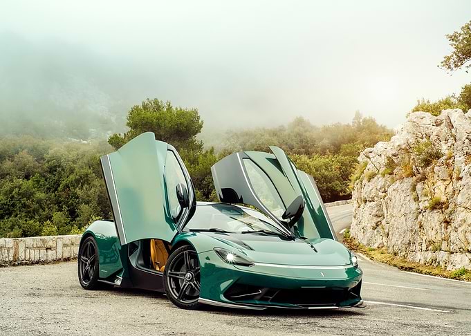 Green Sports Car on Mountain Road