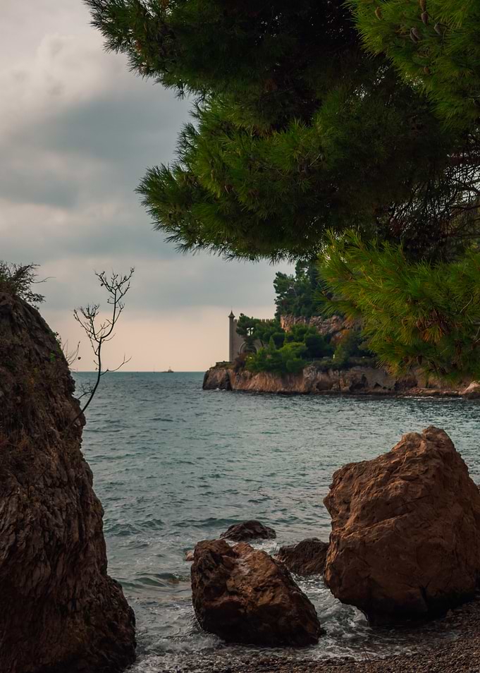 Coastal Serenity with Tower and Pine Tree