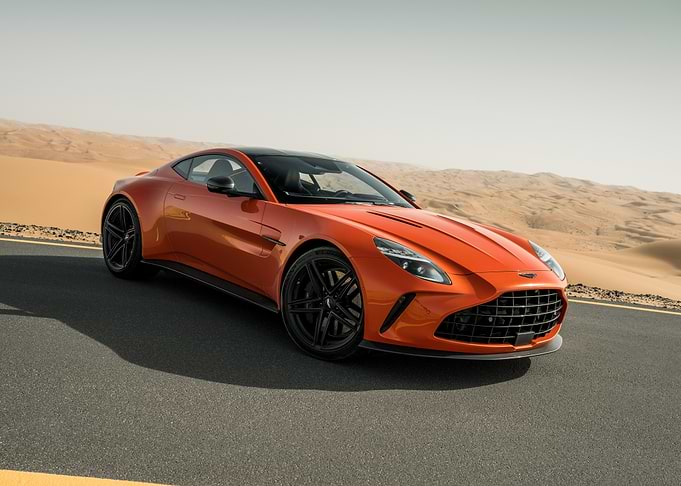Orange Aston Martin in Desert