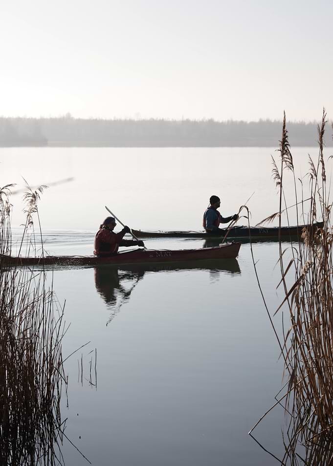 Kayaking on a Misty Lake