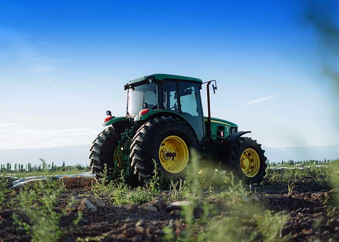 Green Tractor in Field