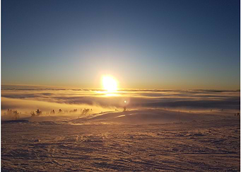 Sunset Over Snowy Landscape