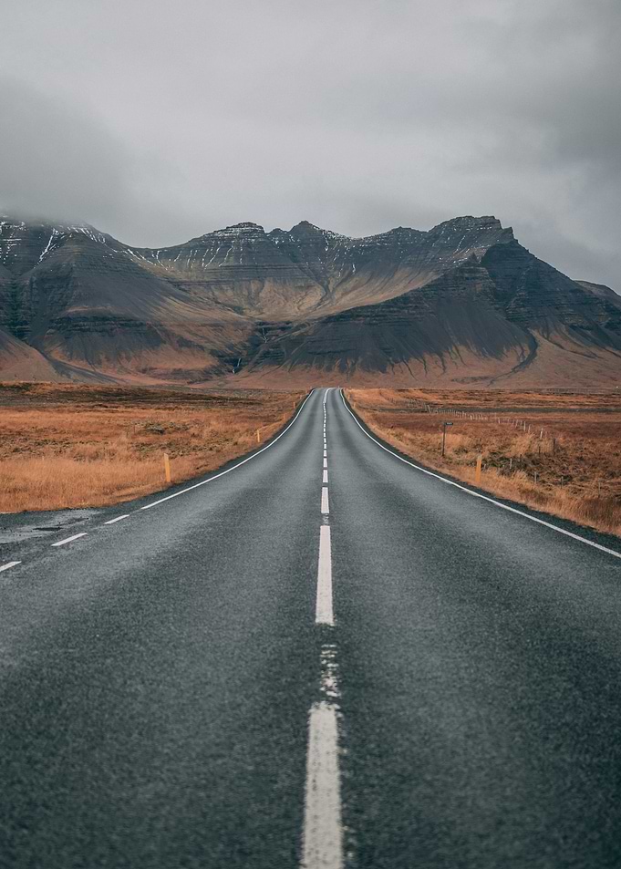 Empty Road Through Mountains