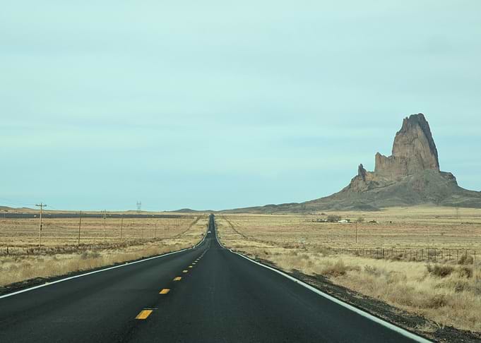 Desert endless Road with Rock Formation