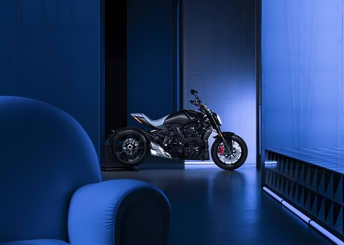Black Motorcycle in Blue Room