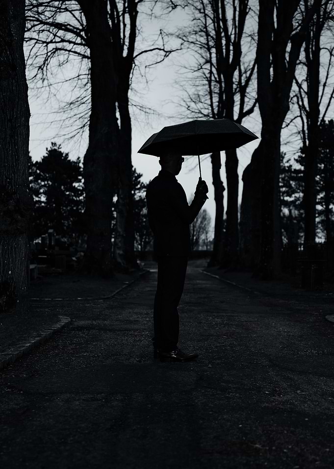 Silhouette Under Umbrella
