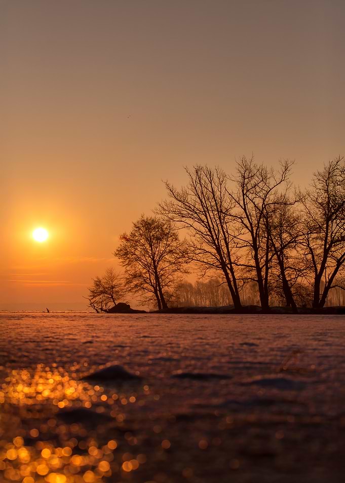 Sunset Over Frozen Lake