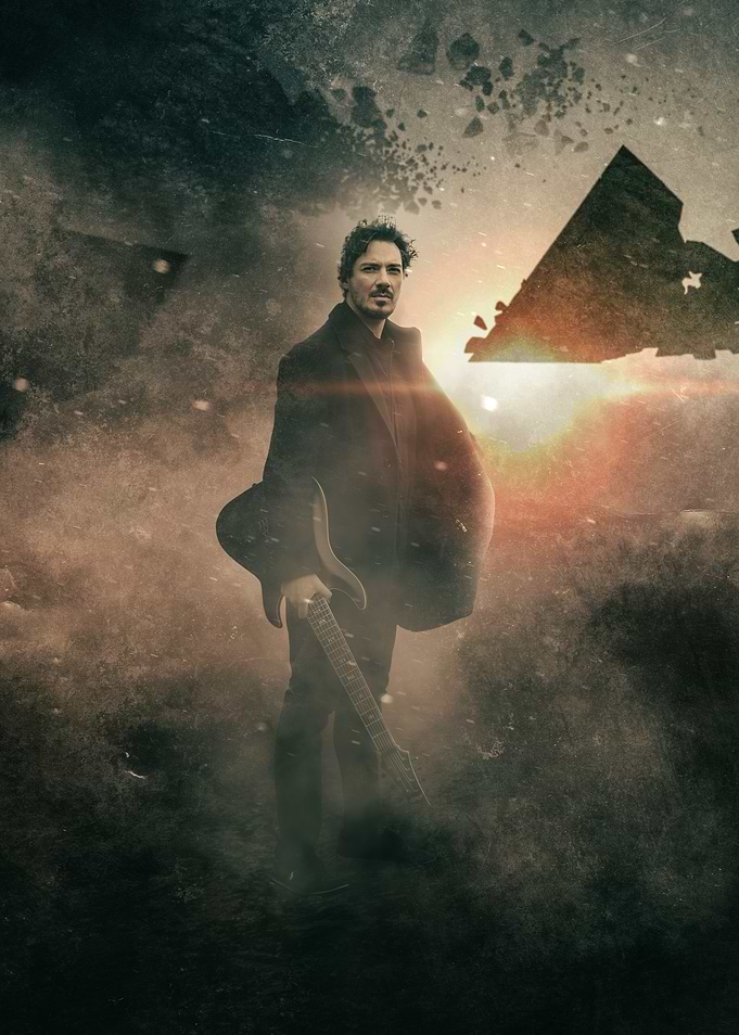 Man with Guitar in Dusty Landscape