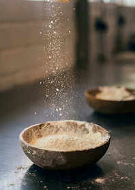 Flour Falling into Bowl