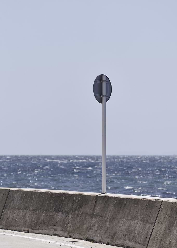 Roadside Sign by the Sea