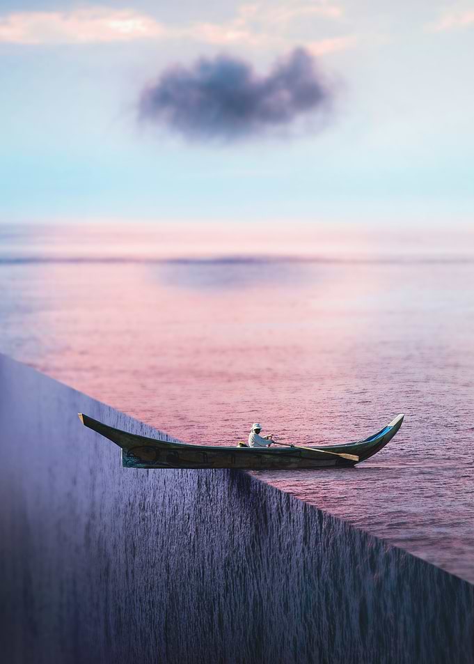 Man Rowing Over Edge
