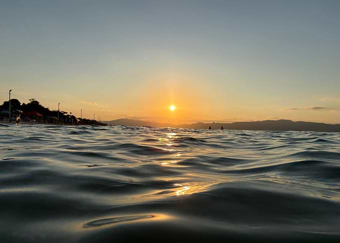 Sunset Over Ocean Waves