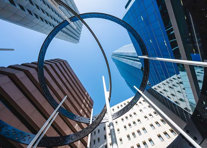 Modern Cityscape with Circular Sculpture