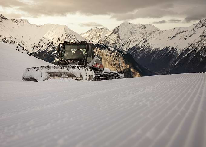 Snowcat in Mountain Landscape