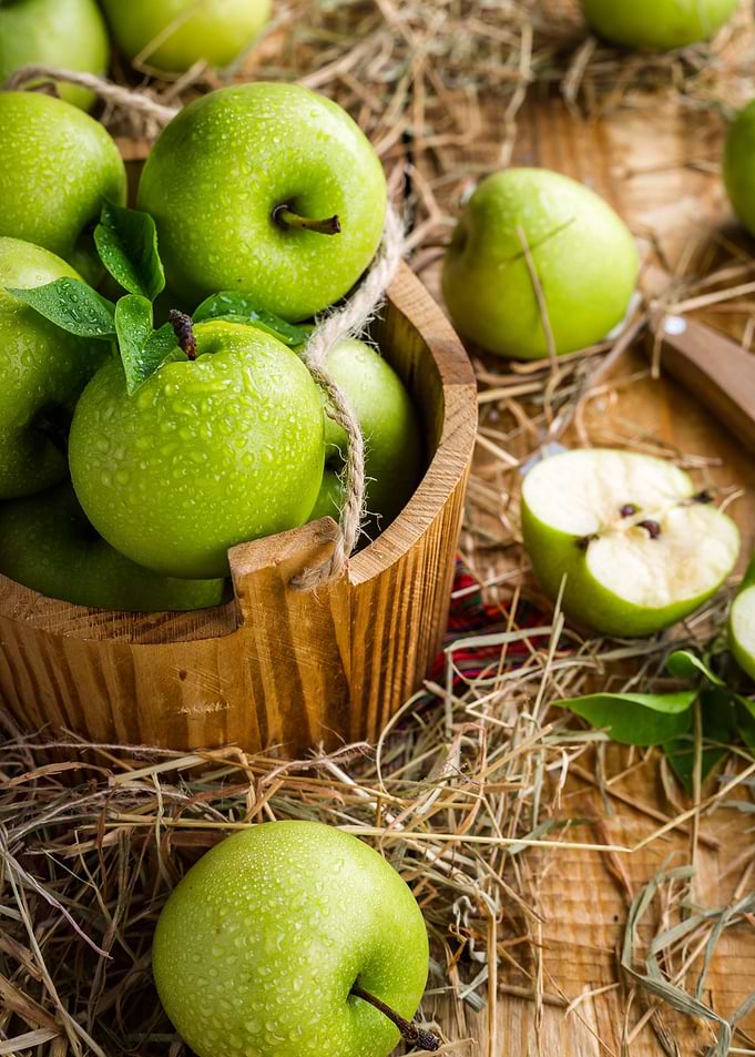Green Apples in Wooden Bucket
