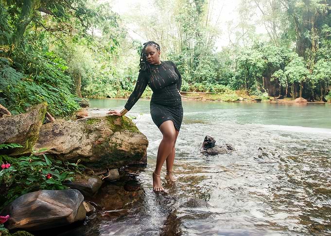 Woman in Black Dress by River