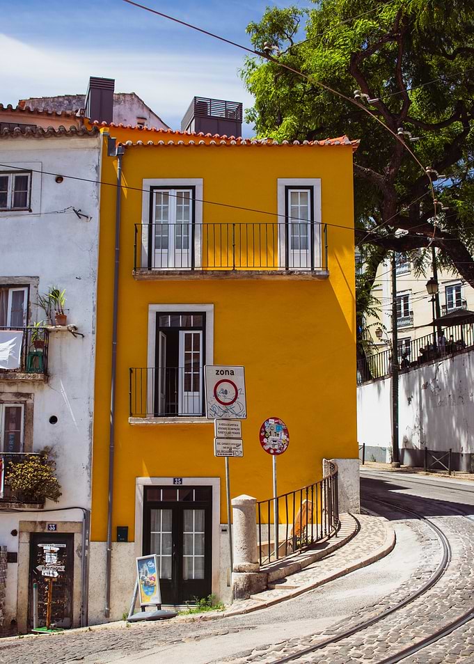 Yellow Building on a Cobblestone Street
