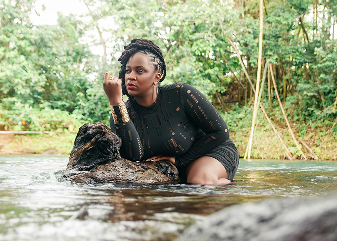 Woman in Black Dress by River
