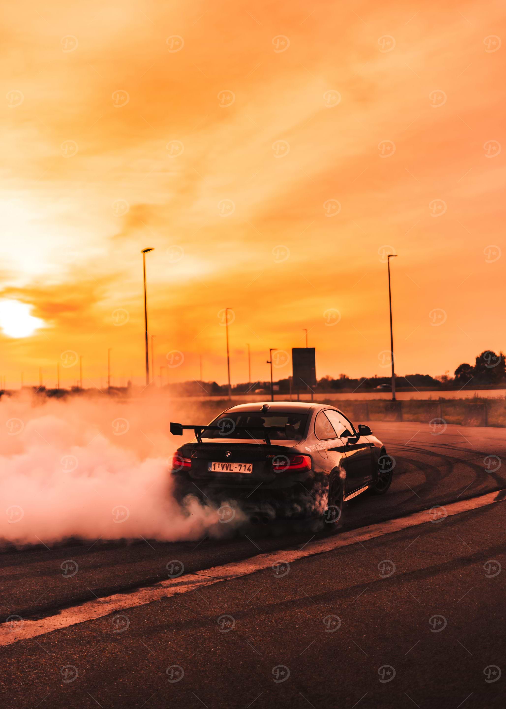 Black BMW Drifting at Sunset