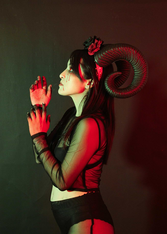 Woman with Horns and Blood