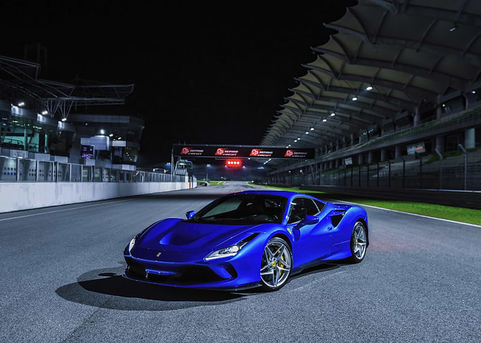 Blue Ferrari on Race Track
