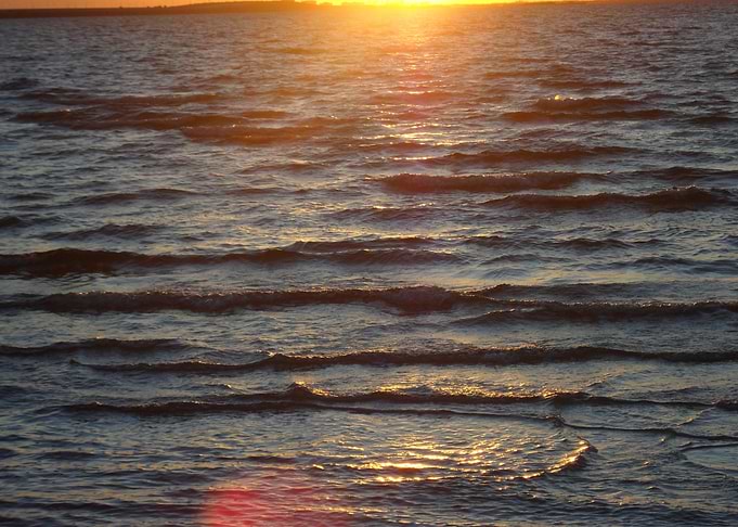 Sunset Over Rippling Water