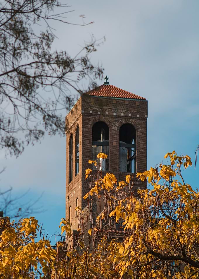 Brick Bell Tower with Autumn Leaves