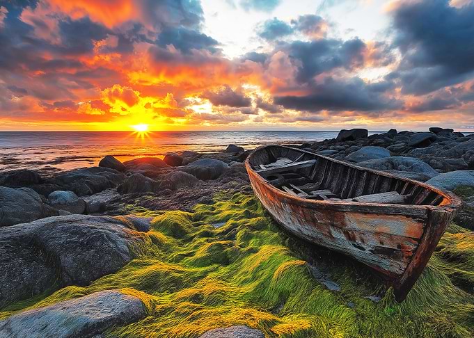 Sunset Boat on Rocky Shore Landscape