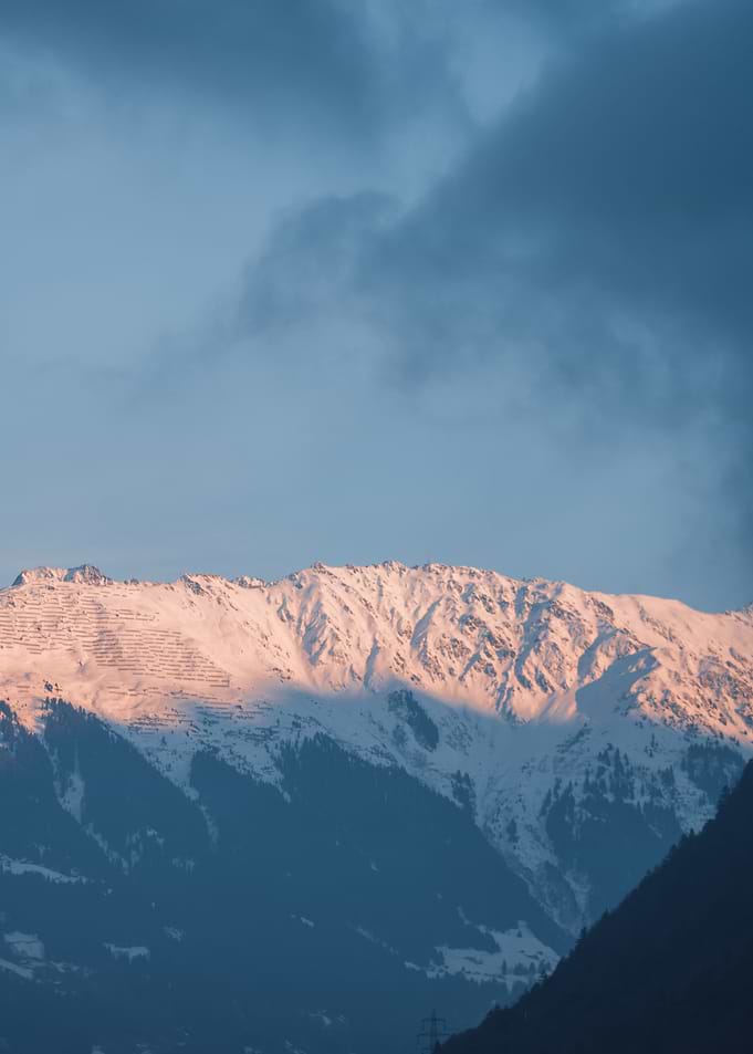 Snowy Mountain Peak at Sunset
