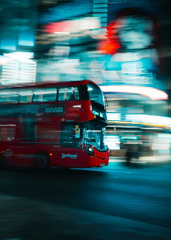 Red Double-Decker Bus in Motion