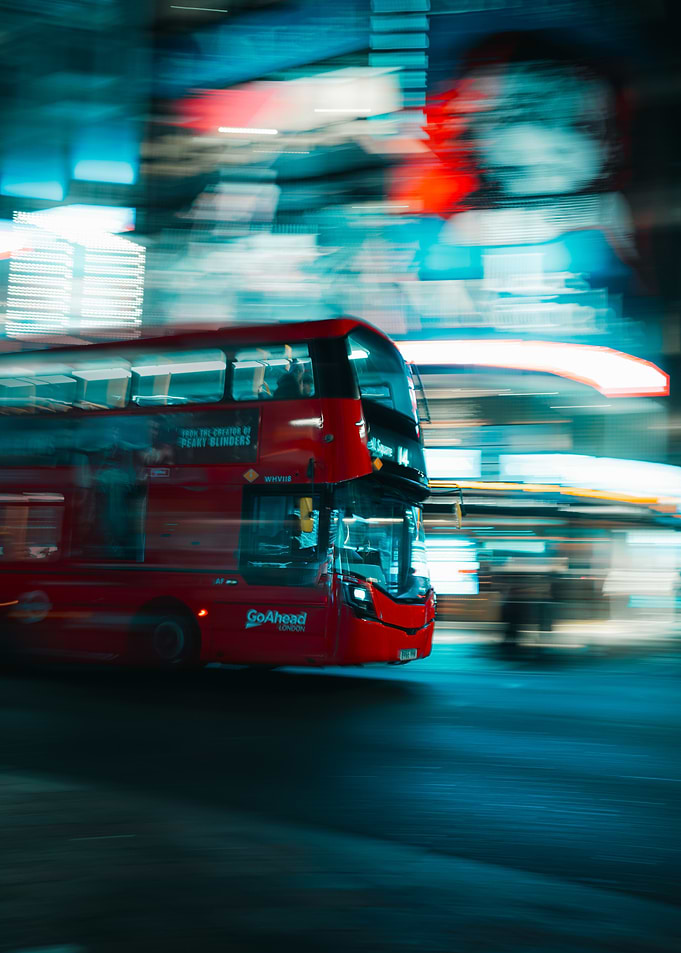 Red Double-Decker Bus in Motion