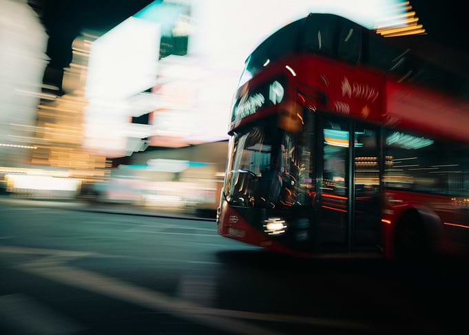 Red Double-Decker Bus in Motion