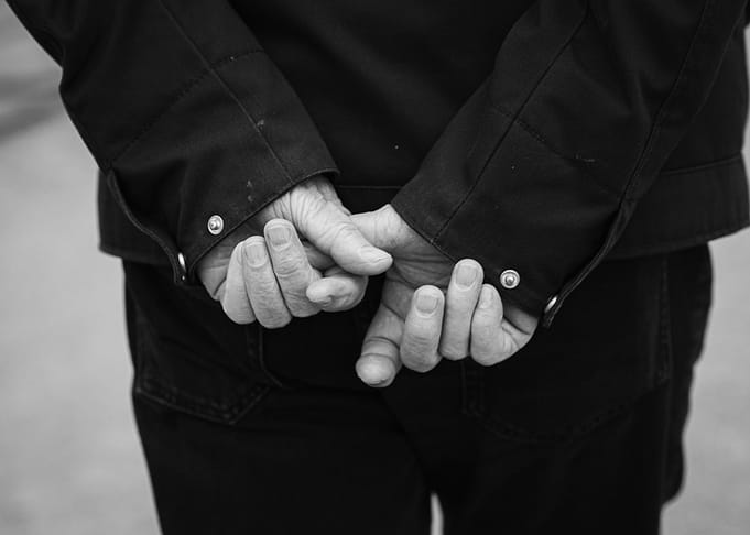 Hands Clasped Behind Back