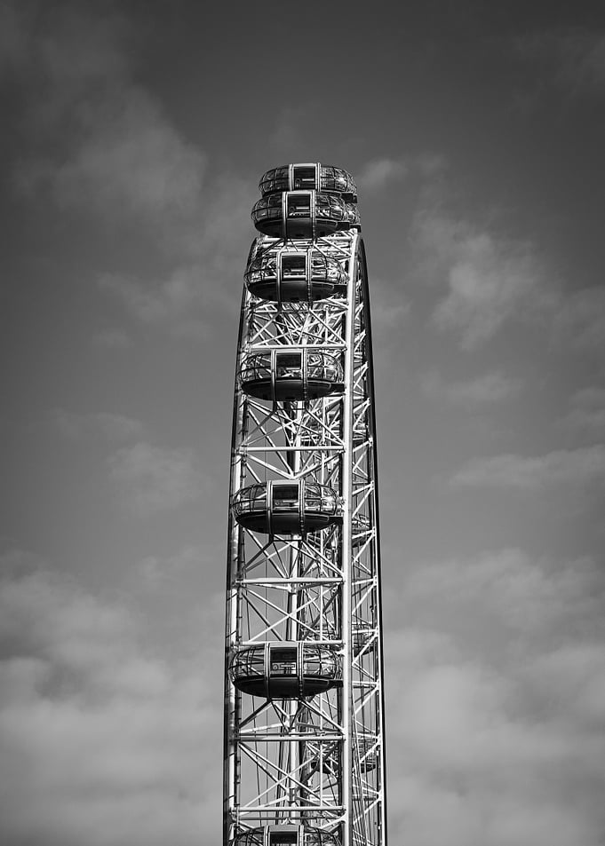 Ferris Wheel Against Cloudy Sky