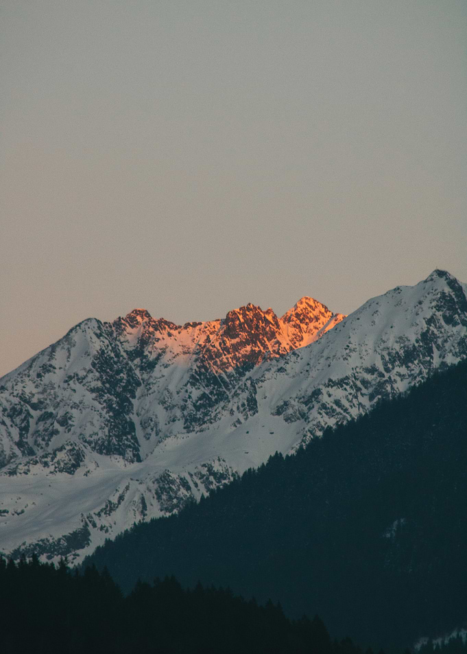 Snowy Mountain Peak at Sunset