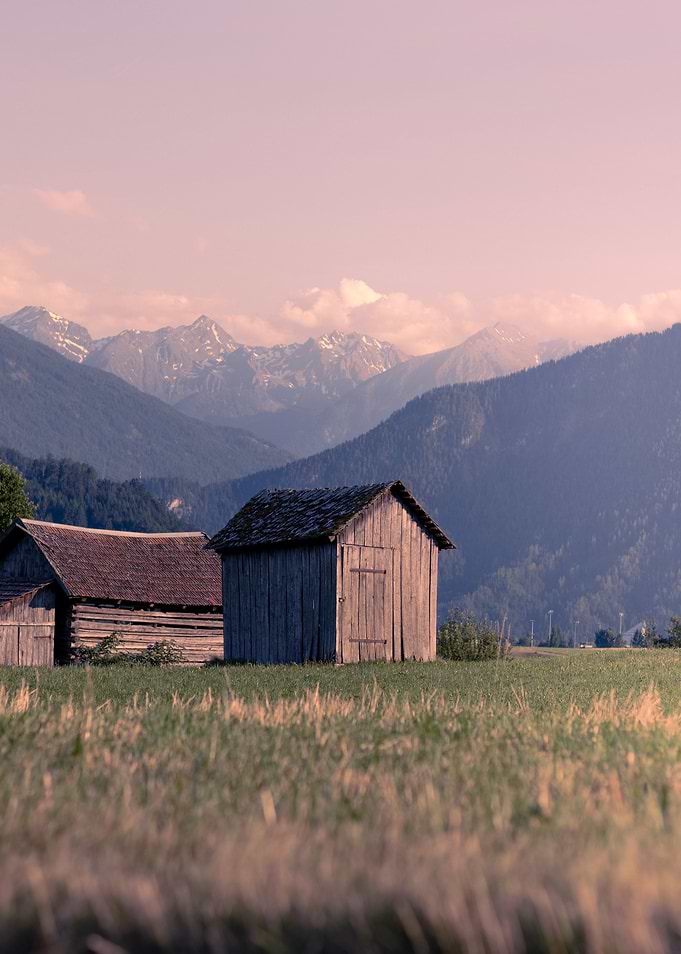 Wooden Sheds in Mountain Landscape