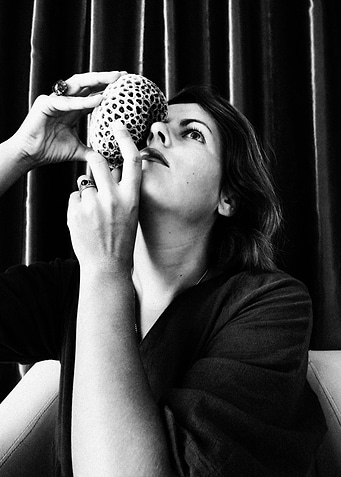 Woman Holding Intricate Sphere