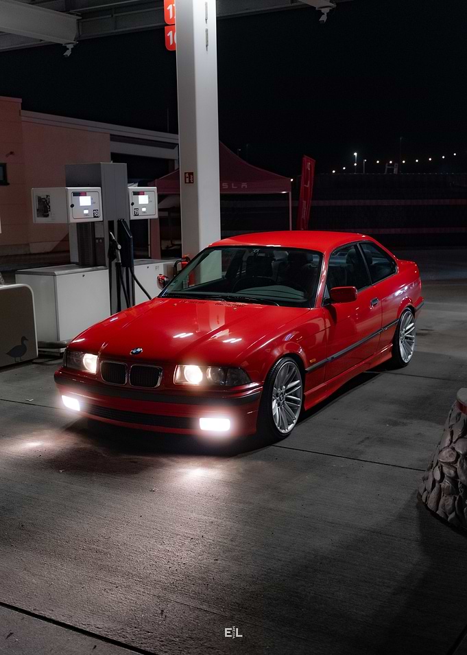 Red BMW at Gas Station