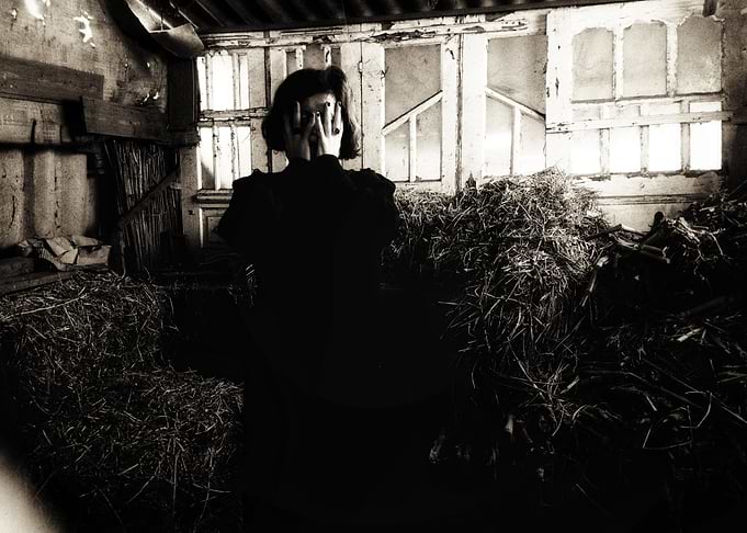 Woman Hiding in Hayloft