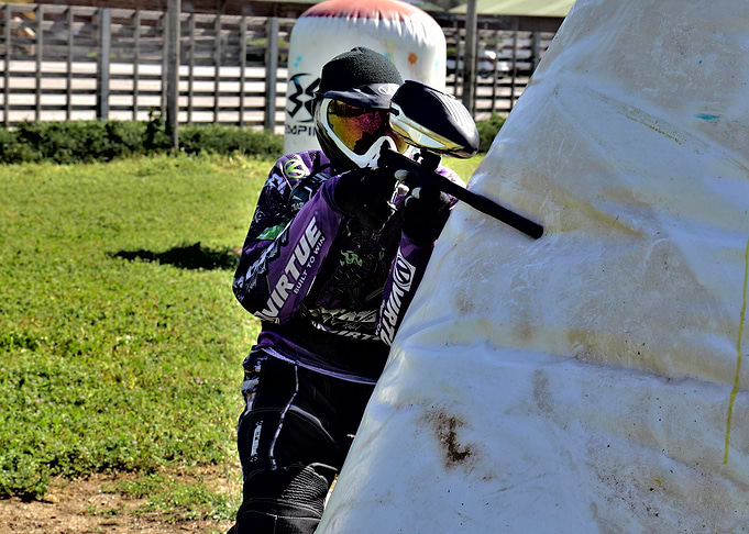 Paintball Player Taking Cover