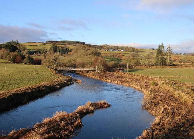 River and Bridge in Rural Landscape