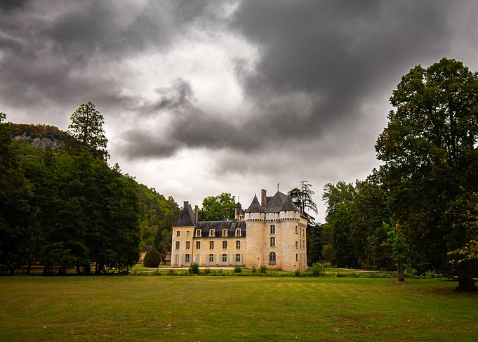French Chateau Under Stormy Skies