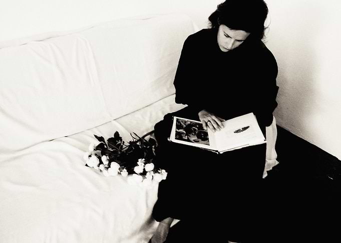 Woman Reading Book on Couch