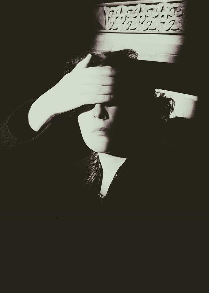 Woman Covering Eyes