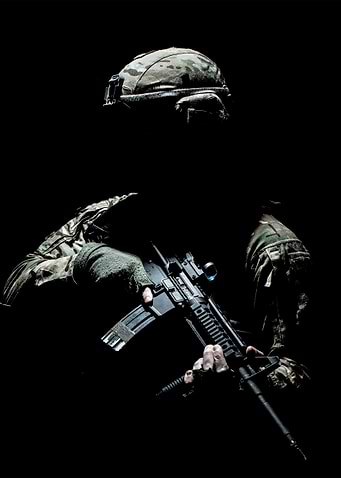 Silhouetted Soldier with Rifle