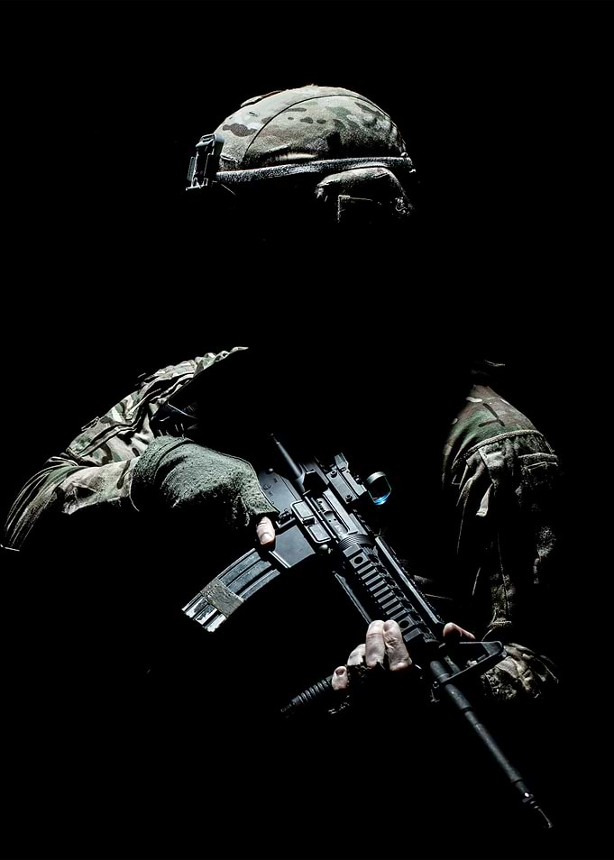 Silhouetted Soldier with Rifle