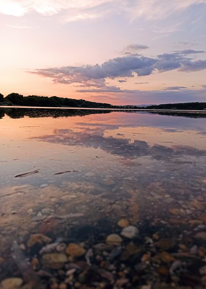 Sunset Reflection on Calm Lake