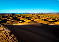 Golden Desert Landscape with Blue Sky in Tinfou, Anti-Atlas, Morocco